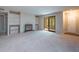 Living room with carpet, fireplace, built-in shelving, and sliding glass doors to a sunroom at 408 Smokerise Se Cir, Marietta, GA 30067