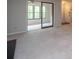 View of the carpeted living room with sunroom, door, and fireplace at 408 Smokerise Se Cir, Marietta, GA 30067