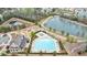Aerial view of community pool, lake, and clubhouse with playground at 4405 Croftshire Pl, Cumming, GA 30040