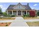 Charming community clubhouse with a covered porch, stone accents, and manicured landscaping at 4405 Croftshire Pl, Cumming, GA 30040