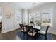 Cozy dining room with hardwood floors, natural light, and a view of the backyard at 4405 Croftshire Pl, Cumming, GA 30040