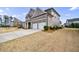 Charming two-story home features a two-car garage, brick accents, and well-maintained landscaping at 4405 Croftshire Pl, Cumming, GA 30040