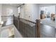 Second floor hallway offers a glimpse into the main bedroom, laundry area, and second-floor bathroom at 4405 Croftshire Pl, Cumming, GA 30040