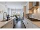 Modern kitchen with a gas cooktop, stainless steel appliances, and a view into the breakfast nook at 4405 Croftshire Pl, Cumming, GA 30040
