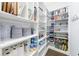Well-organized pantry with abundant shelving, providing ample storage space for kitchen essentials at 4405 Croftshire Pl, Cumming, GA 30040
