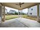 Covered patio with ceiling fan overlooks the spacious, well-maintained backyard at 4405 Croftshire Pl, Cumming, GA 30040