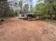 Home exterior shows a deck and expansive backyard perfect for outdoor activities at 675 Sowell Rd, Mcdonough, GA 30252
