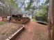 The home features a wooden deck, and an expansive backyard at 675 Sowell Rd, Mcdonough, GA 30252
