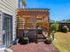 Backyard patio with a pergola, outdoor seating, and well-maintained lawn for entertaining at 7937 Habanera Ln, Lithonia, GA 30058