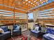 Charming backyard patio with pergola, comfortable seating, and beautiful landscaping for outdoor enjoyment at 7937 Habanera Ln, Lithonia, GA 30058