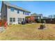 Large backyard with a pergola-covered patio, seating area, and well-maintained lawn, great for outdoor activities at 7937 Habanera Ln, Lithonia, GA 30058