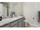 Bathroom featuring a vanity with granite countertops and modern fixtures at 7937 Habanera Ln, Lithonia, GA 30058