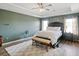 A cozy bedroom featuring neutral colors, tray ceilings and natural light at 7937 Habanera Ln, Lithonia, GA 30058