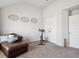A bonus room set up with a lounger and exercise bike at 7937 Habanera Ln, Lithonia, GA 30058