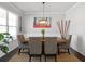 Dining area featuring modern lighting and neutral color palette at 7937 Habanera Ln, Lithonia, GA 30058