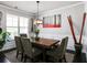 Dining area featuring modern lighting and neutral color palette at 7937 Habanera Ln, Lithonia, GA 30058