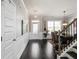 Welcoming foyer features hardwood floors, wainscoting, and a staircase at 7937 Habanera Ln, Lithonia, GA 30058