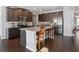 A kitchen featuring granite countertops, stainless steel appliances, and dark wood cabinets at 7937 Habanera Ln, Lithonia, GA 30058