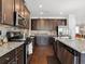 Contemporary kitchen with stainless steel appliances and granite countertops at 7937 Habanera Ln, Lithonia, GA 30058