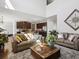 Spacious living room with comfortable seating and an open layout connecting to the kitchen at 7937 Habanera Ln, Lithonia, GA 30058