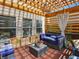 Inviting covered patio with comfortable seating, perfect for relaxing and enjoying the outdoors at 7937 Habanera Ln, Lithonia, GA 30058