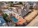 Aerial view of a stunning home with a backyard pool and lush landscaping at 1304 Marietta Country Club Nw Dr, Kennesaw, GA 30152