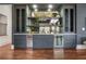 Stylish bar area with custom cabinetry, mirrored backsplash, and beverage coolers at 1304 Marietta Country Club Nw Dr, Kennesaw, GA 30152