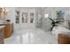 Bright bathroom with soaking tub, glass shower, and marble flooring provides a spa-like experience at 1304 Marietta Country Club Nw Dr, Kennesaw, GA 30152