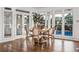 Charming breakfast nook with hardwood floors, white trim, and lots of natural light overlooking the backyard and pool at 1304 Marietta Country Club Nw Dr, Kennesaw, GA 30152
