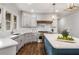 Modern kitchen featuring marble countertops and backsplash, gray cabinets, and stainless steel appliances at 1304 Marietta Country Club Nw Dr, Kennesaw, GA 30152