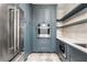 Stylish kitchen with stainless steel appliances, custom cabinets, and tiled floors at 1304 Marietta Country Club Nw Dr, Kennesaw, GA 30152