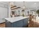 Open concept kitchen with an island, marble countertops, and a view of the dining area at 1304 Marietta Country Club Nw Dr, Kennesaw, GA 30152