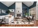 Cozy living room with high ceilings, fireplace, and a large window bringing in natural light at 1304 Marietta Country Club Nw Dr, Kennesaw, GA 30152