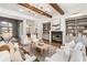Inviting living room with hardwood floors, a fireplace, custom built-ins and an archway leading to a dining room at 1304 Marietta Country Club Nw Dr, Kennesaw, GA 30152