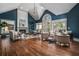 Spacious living room with vaulted ceiling, large windows, fireplace and hardwood floors at 1304 Marietta Country Club Nw Dr, Kennesaw, GA 30152