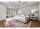 Inviting main bedroom with trey ceiling, sitting area, and ample natural light at 1304 Marietta Country Club Nw Dr, Kennesaw, GA 30152