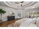 Bright main bedroom featuring ensuite bath, trey ceilings, and sitting area at 1304 Marietta Country Club Nw Dr, Kennesaw, GA 30152