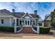 Beautiful rear elevation of a brick home with a patio and well-manicured landscaping at 1304 Marietta Country Club Nw Dr, Kennesaw, GA 30152