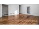 Spacious room with hardwood flooring and natural light perfect for living or entertaining at 1304 Marietta Country Club Nw Dr, Kennesaw, GA 30152