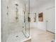 Modern glass shower with stone tile and rainfall shower head for a spa-like experience at 1304 Marietta Country Club Nw Dr, Kennesaw, GA 30152