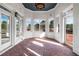 Bright sunroom with brick floors, white brick walls, and many windows at 1304 Marietta Country Club Nw Dr, Kennesaw, GA 30152