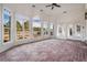 Spacious sunroom with brick floors, large windows with a view of the yard at 1304 Marietta Country Club Nw Dr, Kennesaw, GA 30152