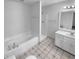 Bathroom featuring a bath and shower, a vanity with a sink and a patterned tile floor at 160 Benjamin Cir, Fayetteville, GA 30214