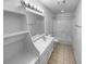 Clean, well-lit bathroom featuring a vanity with sink, storage shelves, and a shower/tub combo at 160 Benjamin Cir, Fayetteville, GA 30214