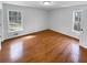 Bedroom featuring new hardwood floors and two windows at 160 Benjamin Cir, Fayetteville, GA 30214