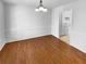 Dining room with hardwood floors next to kitchen, filled with natural light at 160 Benjamin Cir, Fayetteville, GA 30214