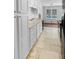 Bright kitchen featuring white cabinets, a window, and tile flooring for a clean, modern look at 160 Benjamin Cir, Fayetteville, GA 30214