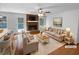 Bright living room featuring a brick fireplace and ample seating space at 160 Benjamin Cir, Fayetteville, GA 30214