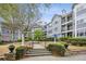 Apartment complex with landscaped grounds, walkways, and mature trees provides a welcoming environment at 4100 Paces Se Walk # 2309, Atlanta, GA 30339
