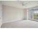 Spacious bedroom featuring neutral carpeting and access to a private balcony at 4100 Paces Se Walk # 2309, Atlanta, GA 30339